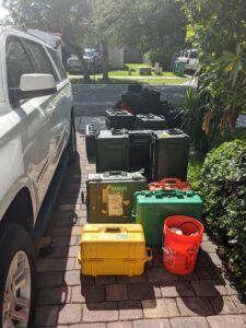 Car and stacks of equipment next to the car